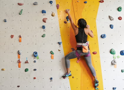 woman indoor mountain climbing
